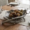Woodland Metal Bowl in aluminium with leaf-inspired texture, filled with pinecones on a rustic tray.