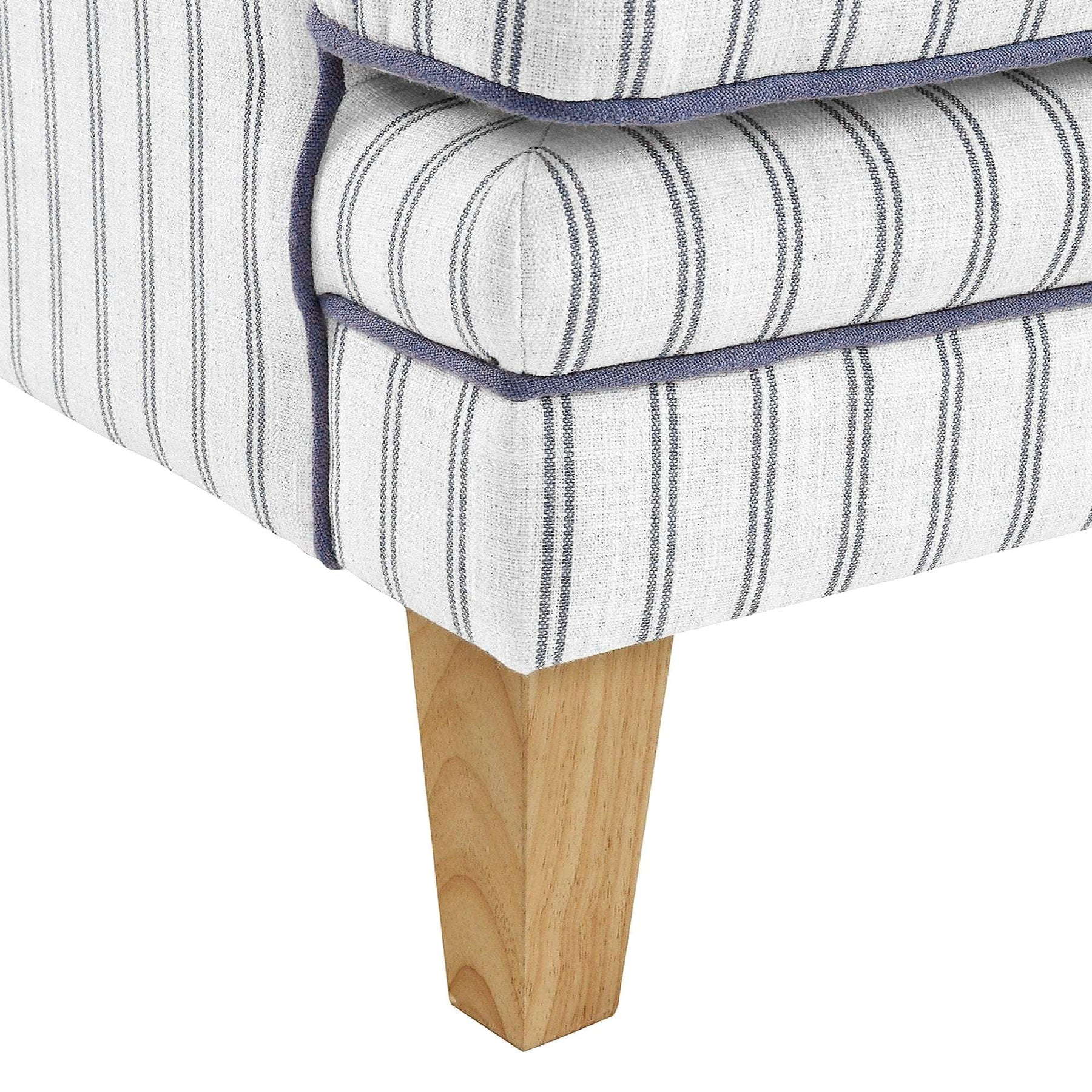 Anchorage Lounge Chair in Newport Stripe fabric with blue piping and light wood legs.