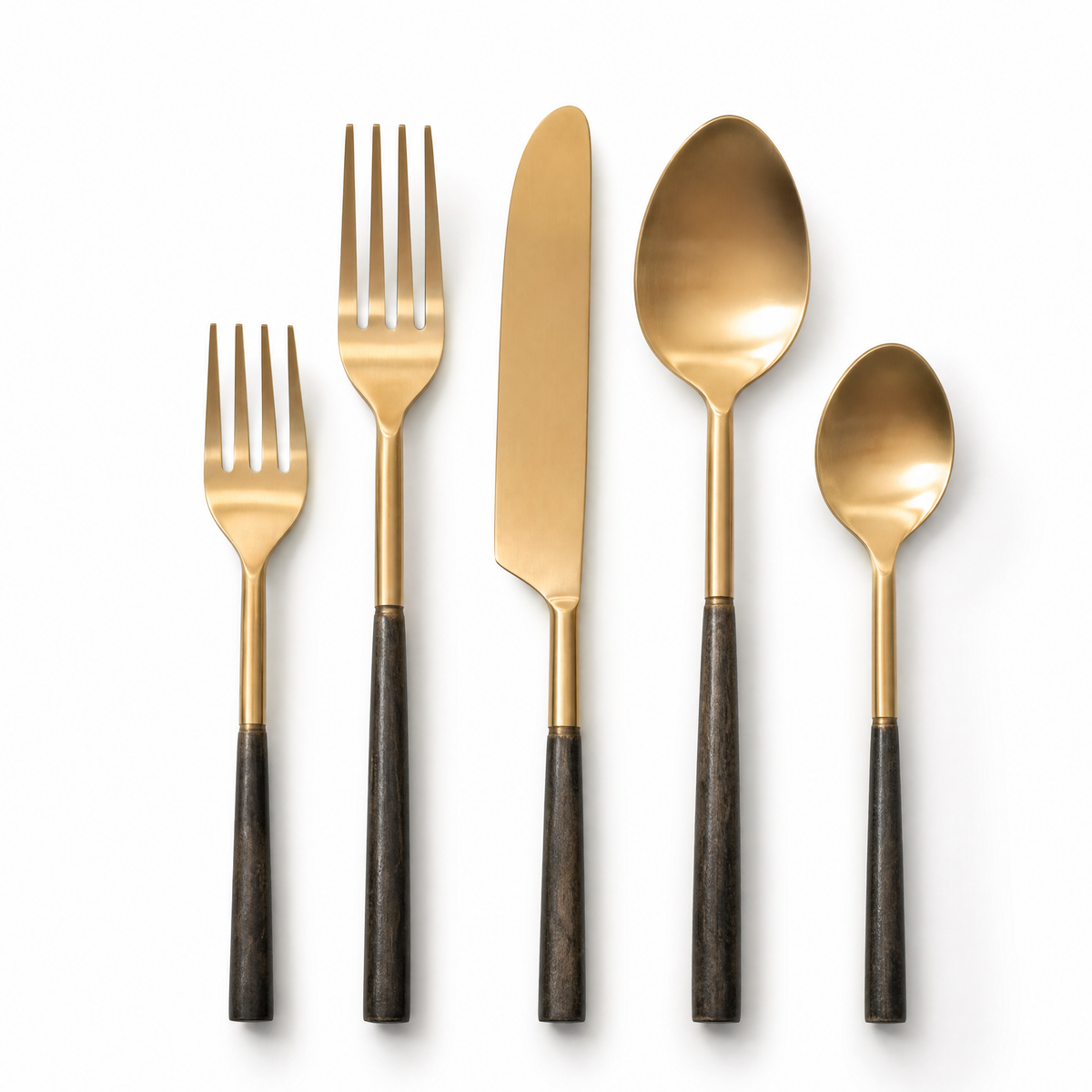 Bronte 5-piece cutlery set with matte gold heads and dark burnished handles, laid out in a row.