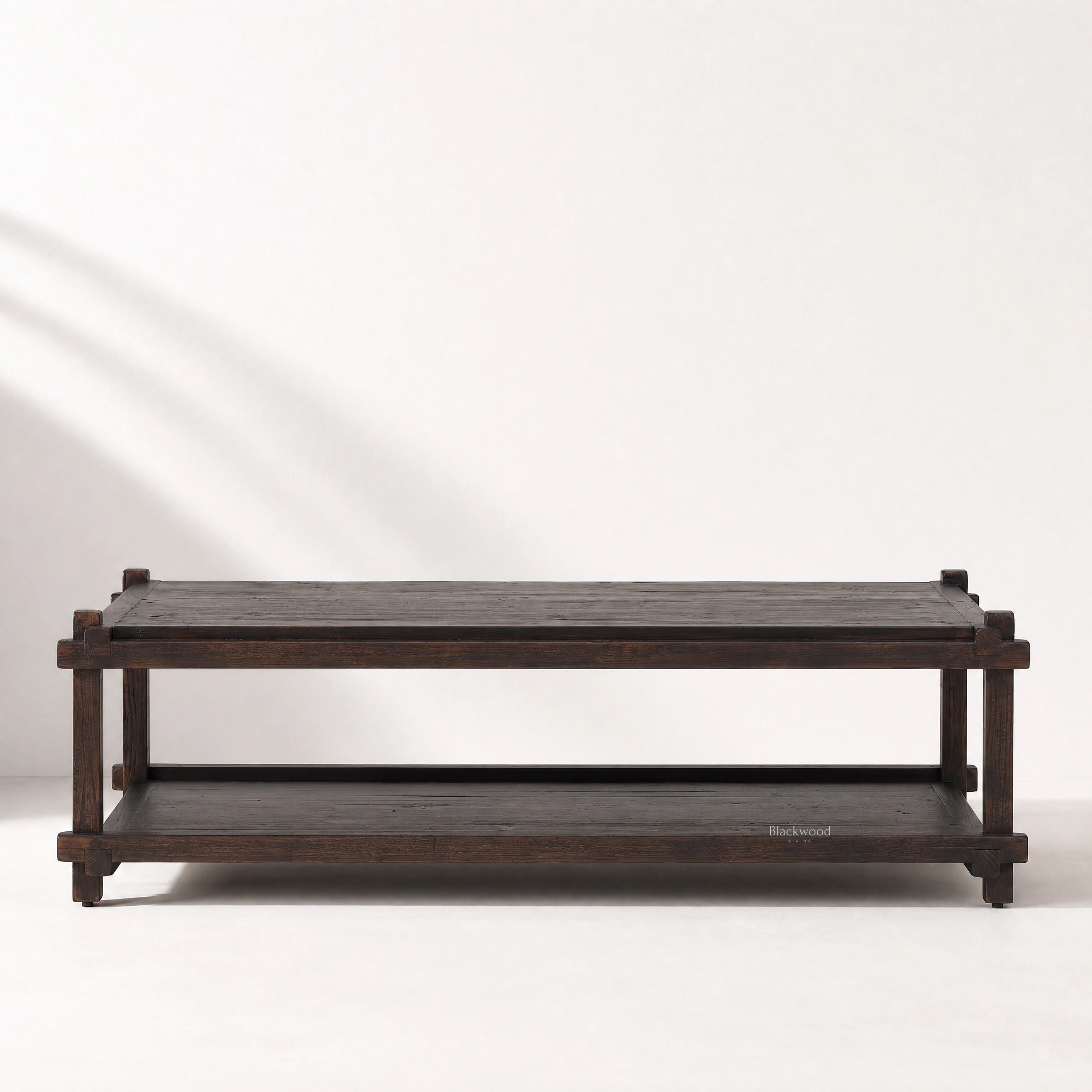 Millhouse Coffee Table in solid fir with walnut stain, featuring a low architectural profile and open lower shelf.