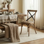 Hawthorne Oak Dining Chair with curved timber frame, woven seat, and antique metal detailing in a farmhouse setting