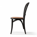 Langford Oak Bistro Chair with solid oak frame, hand-finished rattan back, and cushioned woven seat.