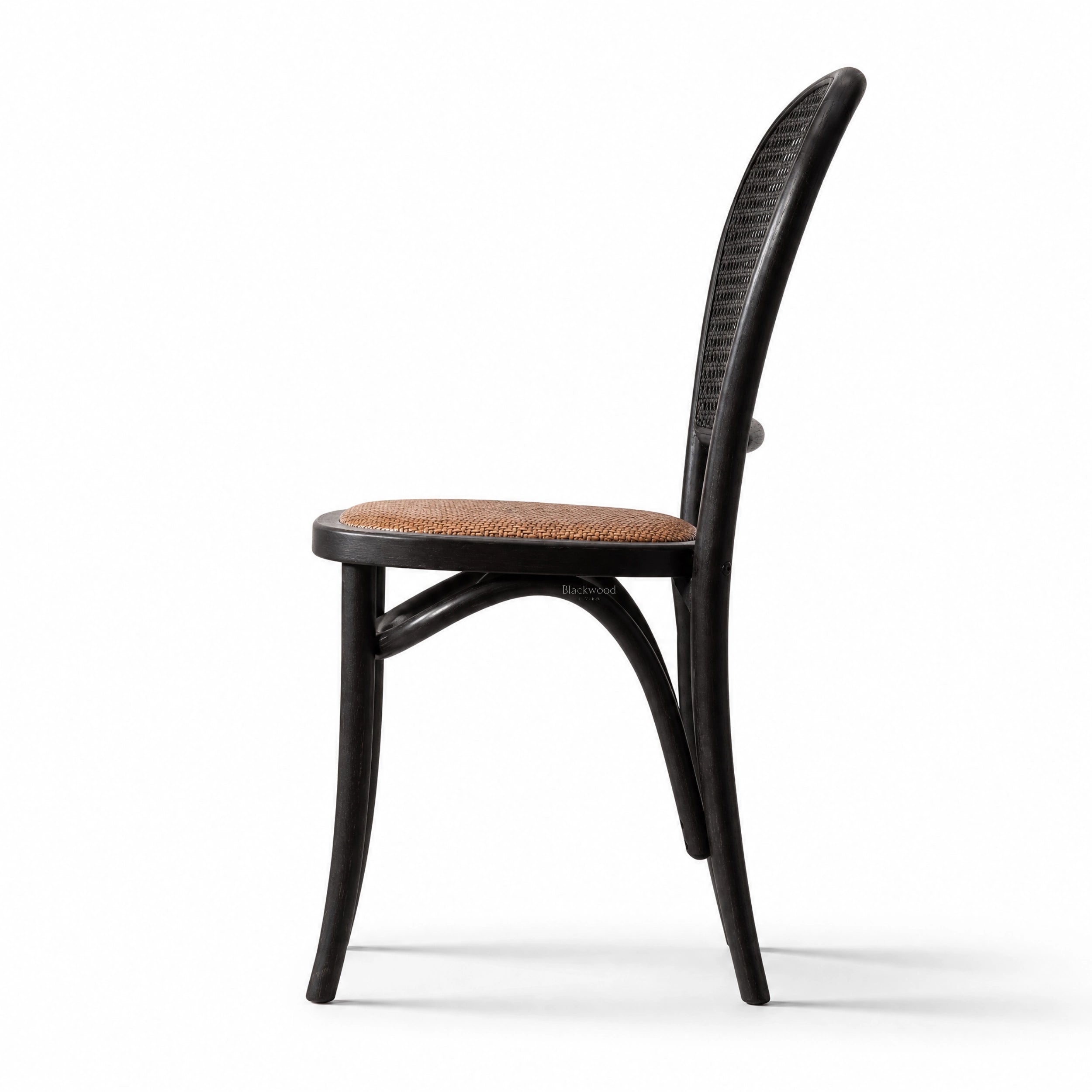Langford Oak Bistro Chair with solid oak frame, hand-finished rattan back, and cushioned woven seat.