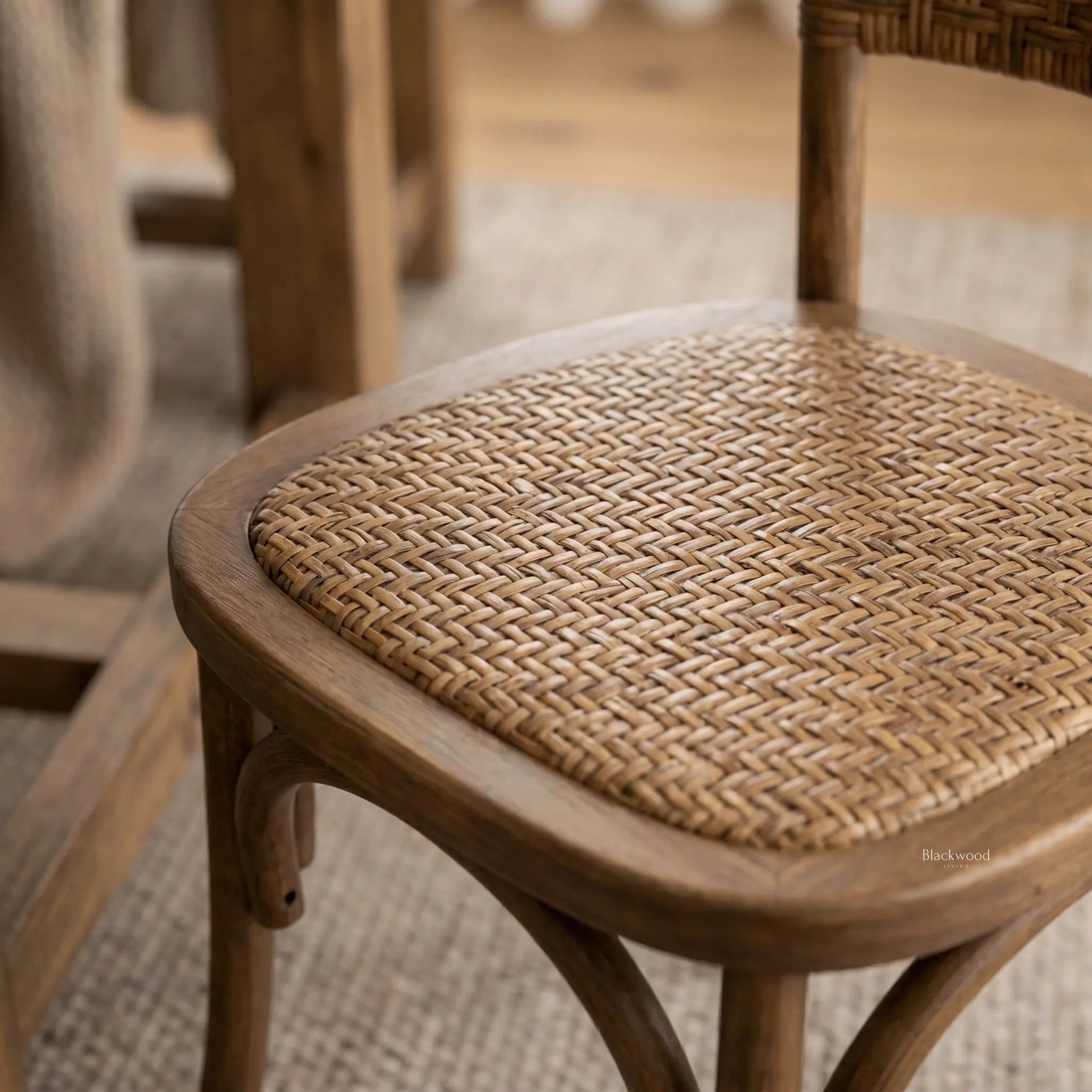 Willowmere Oak Dining Chair with handwoven rattan seat and warm antique oak frame.