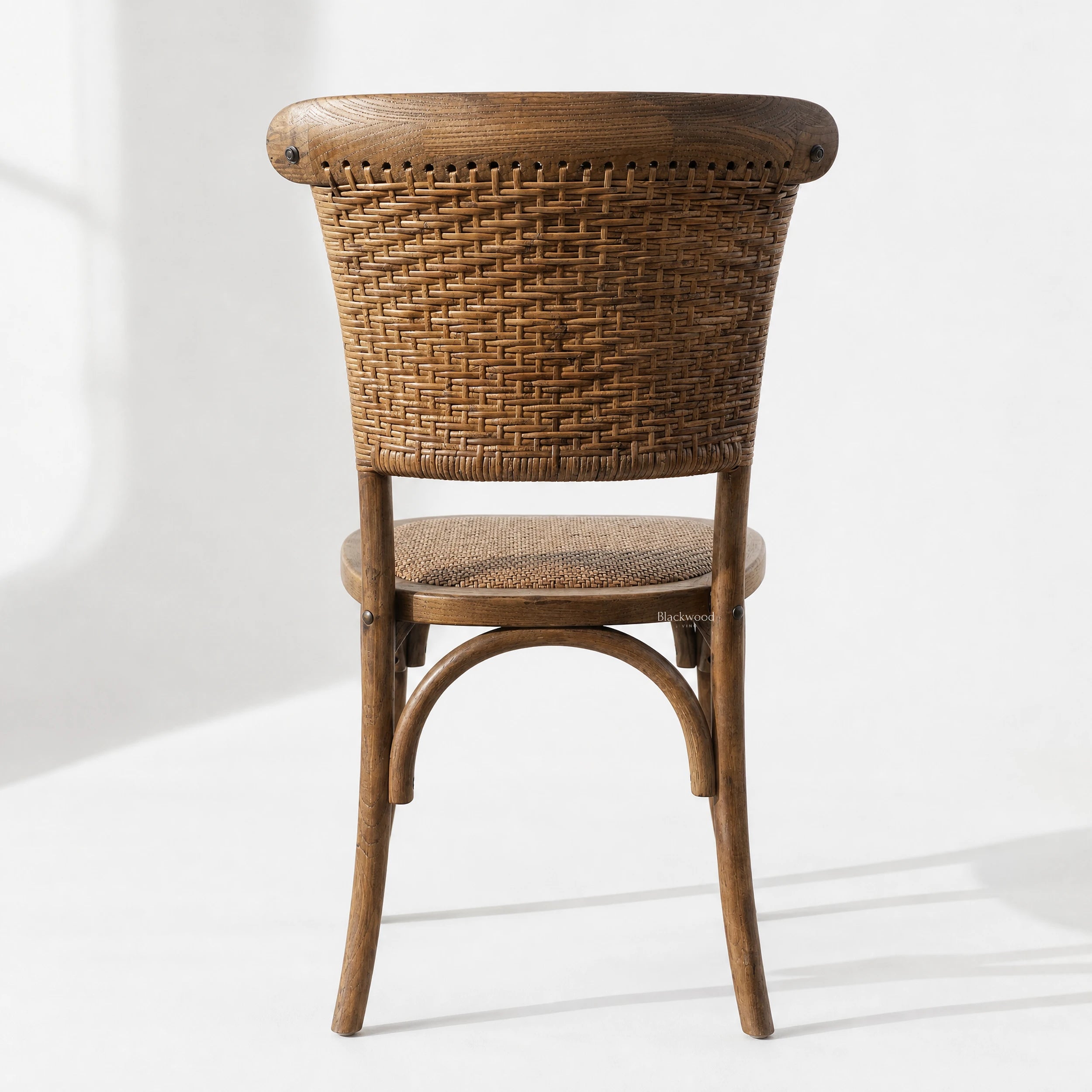 Willowmere Oak Dining Chair with antique oak frame and handwoven rattan detailing, farmhouse charm.