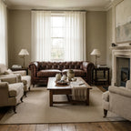 Ashcroft Sofa Three Seat in top-grain South American cow leather, deep buttoned Chesterfield with rolled arms.