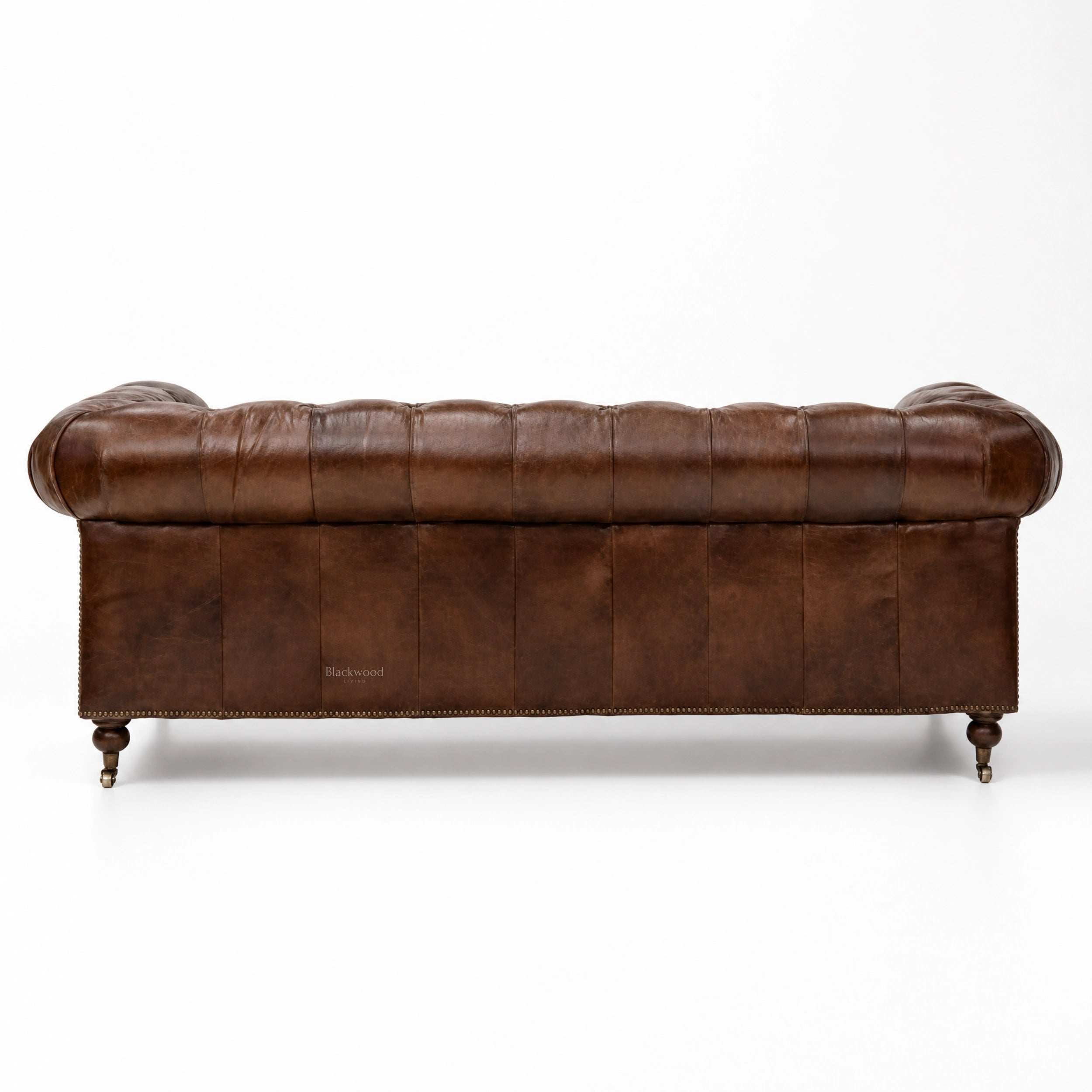Ashcroft Sofa - Three Seat in brown top-grain cow leather with deep buttoned Chesterfield, brass studs, rolled arms.