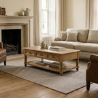 Somerset Oak Coffee Table in a warm living room; solid oak, generous proportions, turned legs, drawer detailing.