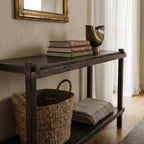 Millhouse Console in Antique Walnut solid fir, farmhouse-style entryway table with books and a metal vase.
