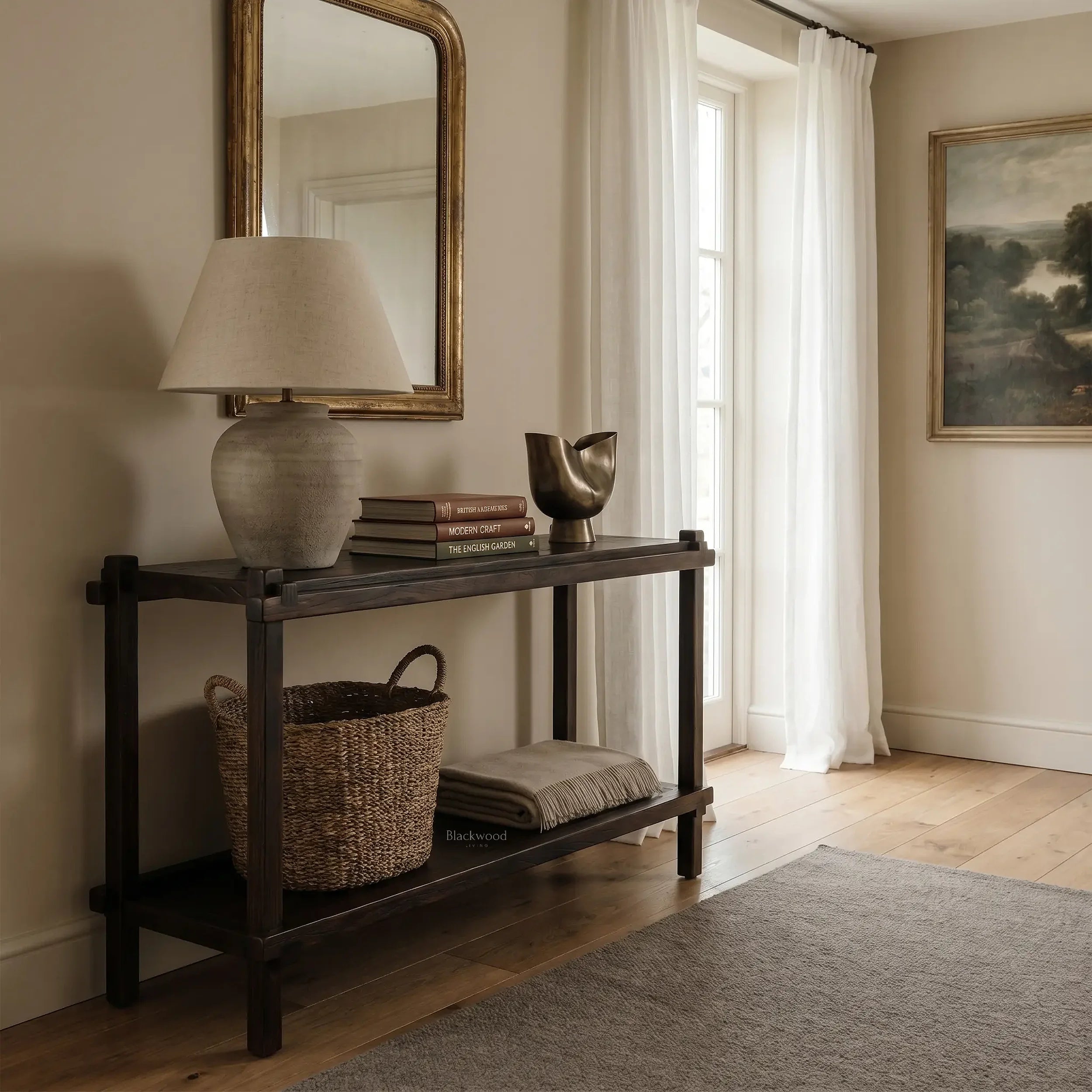 Millhouse Console in solid fir with Antique Walnut finish, shown with lamp, books, mirror in farmhouse entryway