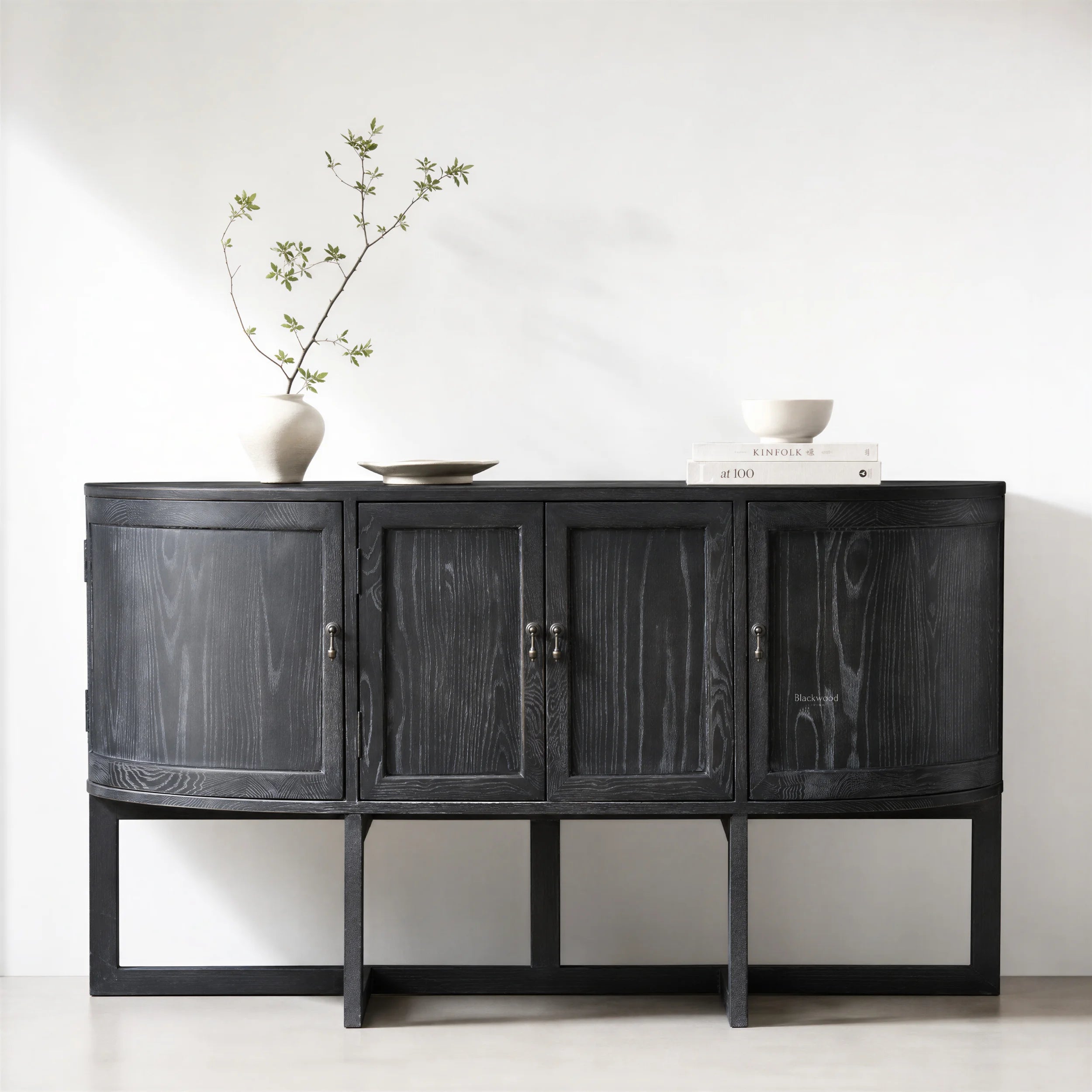 Ravenswood Hall Table in reclaimed oak with a dark finish, featuring curved ends and architectural lines.