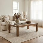 Aldridge Coffee Table in solid reclaimed pine with a hand-laid parquet top in a neutral living room.