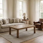 Aldridge Coffee Table in solid reclaimed pine with hand-laid parquet top in a sunlit living room.