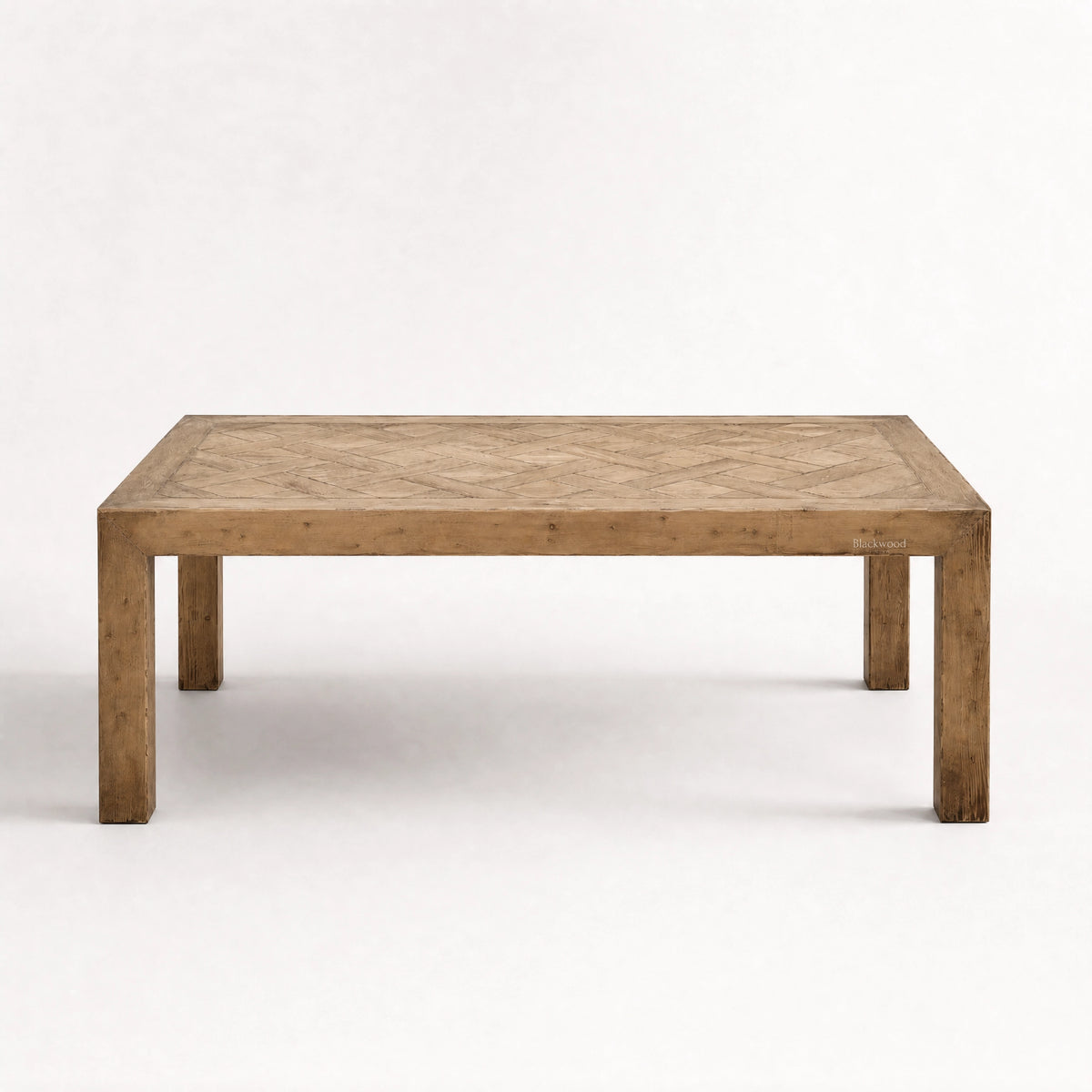 Aldridge Coffee Table in solid reclaimed pine with a hand-laid parquet top, highlighting natural variation and warmth.