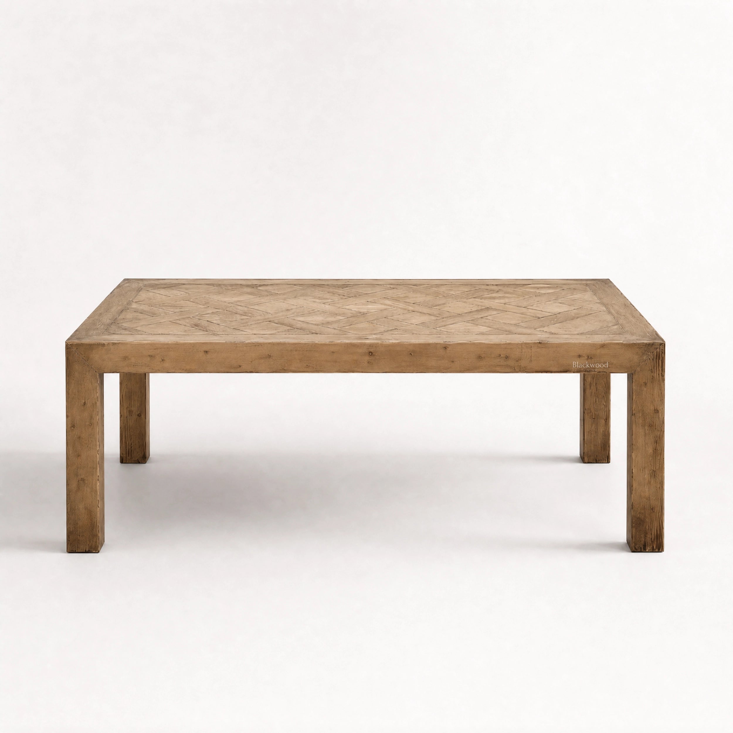 Aldridge Coffee Table in solid reclaimed pine with a hand-laid parquet top, highlighting natural variation and warmth.