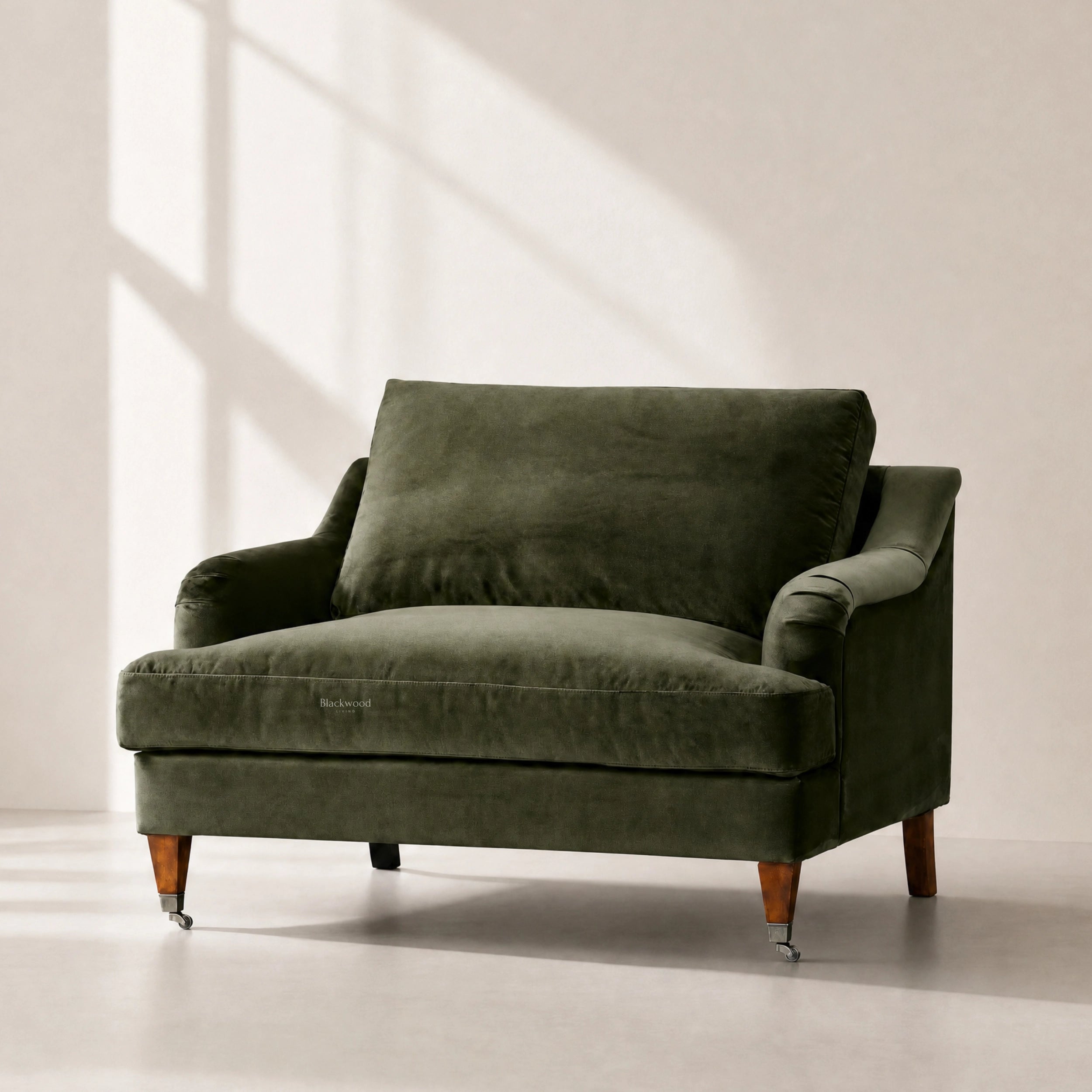 Olive polyester velvet Ashcroft 1.5-seat chair with deep cushion and wooden legs.