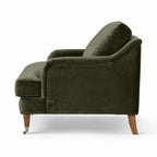 Olive velvet Ashcroft Chair with deep cushioned seat, curved arms, and wooden legs.