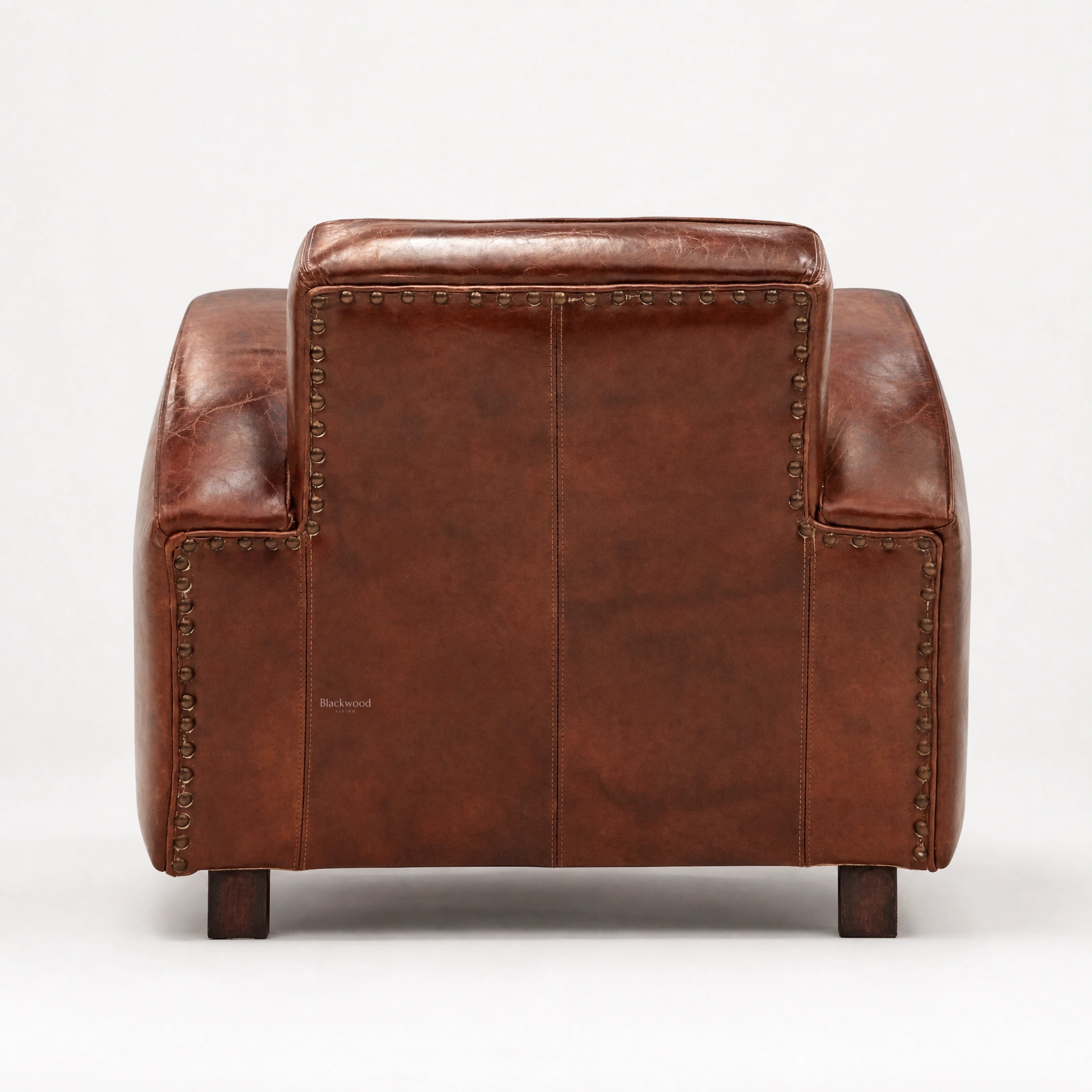 Back of Kingsford Leather Armchair in Vintage Tobacco South American top-grain cow leather with studded nailhead trim.