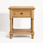 Oakridge Bedside Table in solid oak with turned legs, framed drawer front, and lower shelf.