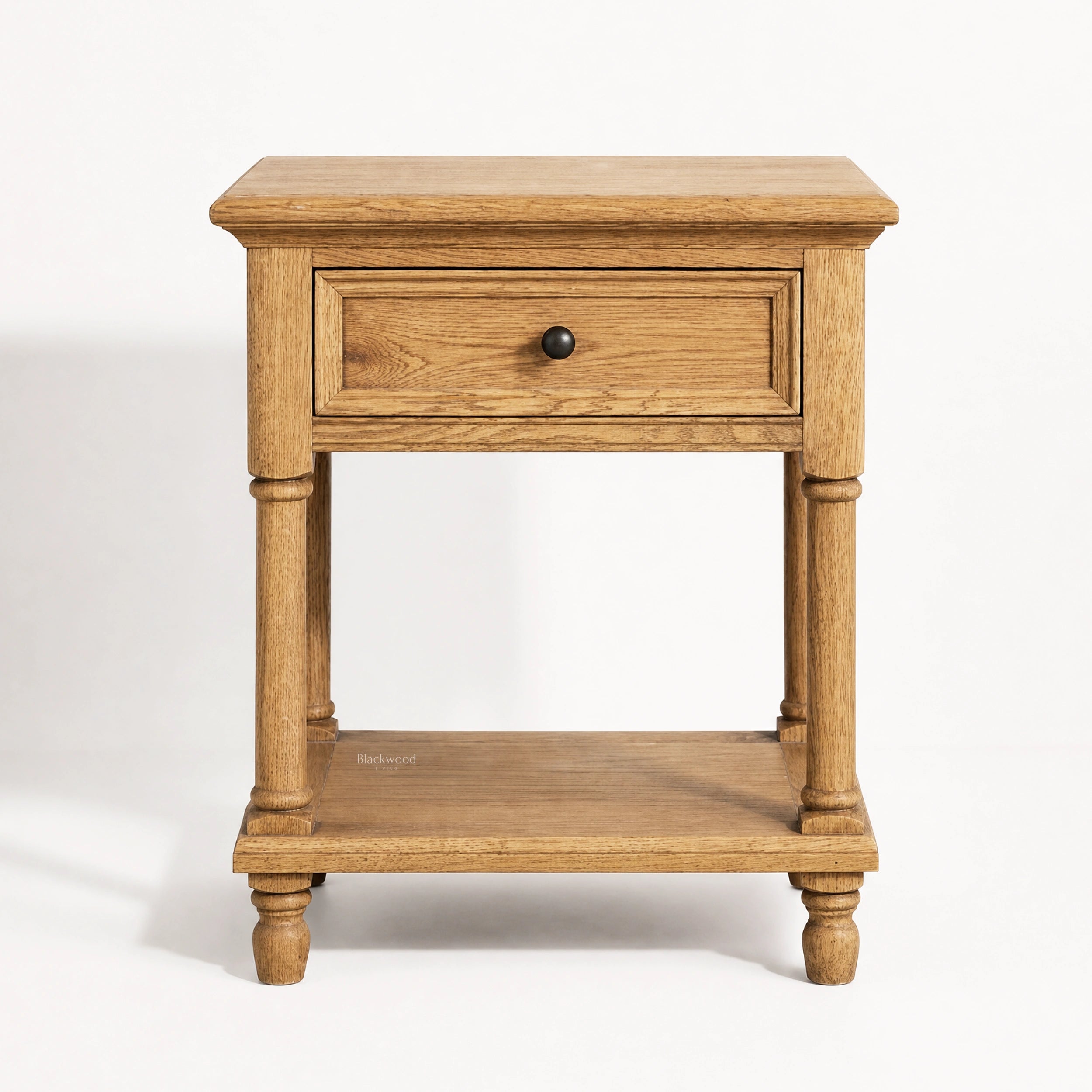Oakridge Bedside Table in solid oak with turned legs, framed drawer front, and lower shelf.