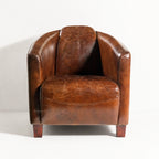 Dalton Club Chair in South American top-grain cow leather with a solid rubber wood frame, close-up of curved arms