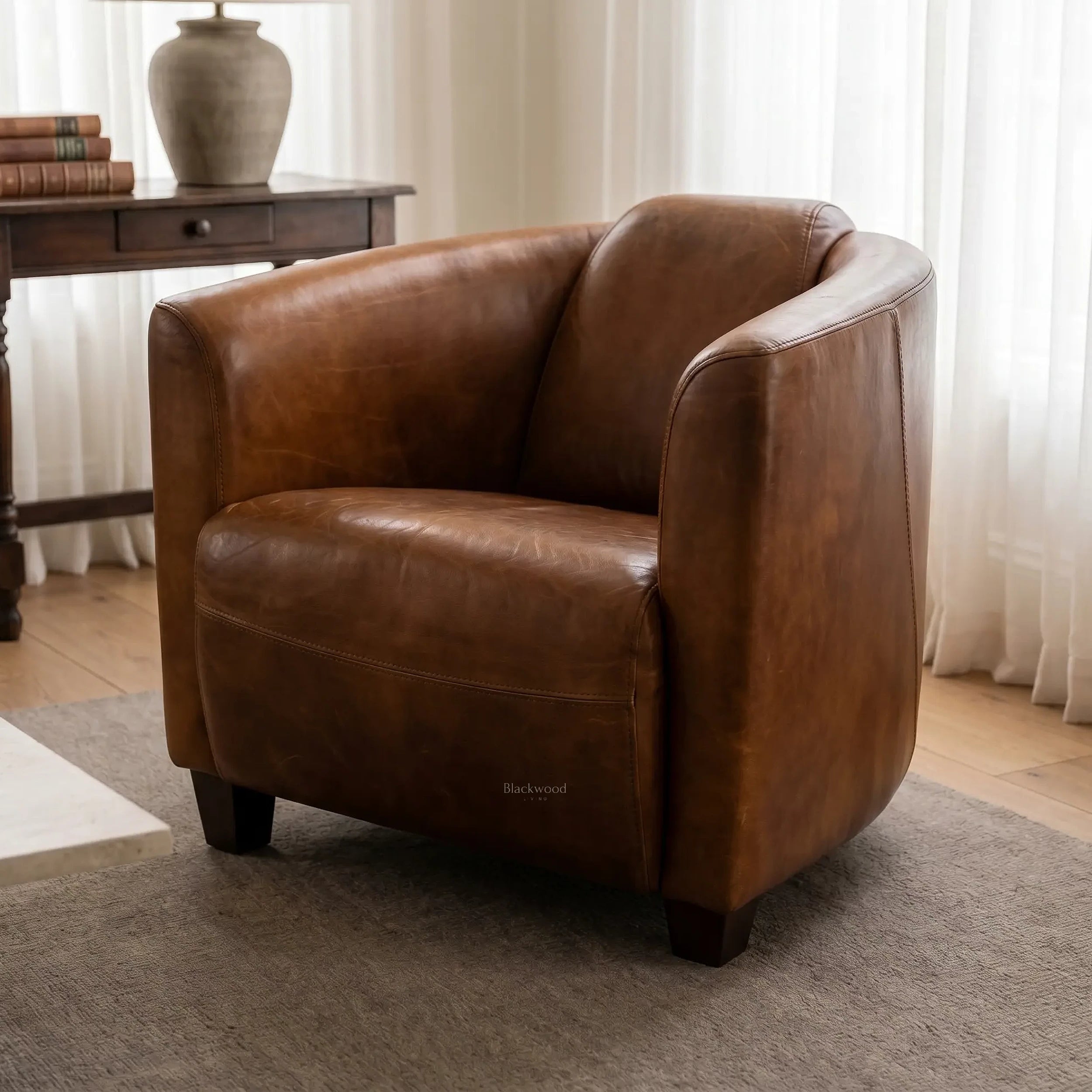 Dalton Club Chair in South American top-grain cow leather with a solid rubber wood frame; anchors a room with timeless comfort.