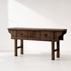 The Raffles Console in aged elm timber, with rich grain and timeless plantation silhouette.