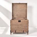 Avignon Trunk Table in reclaimed oak with concealed storage, exposed timber grain, and forged metal detailing.
