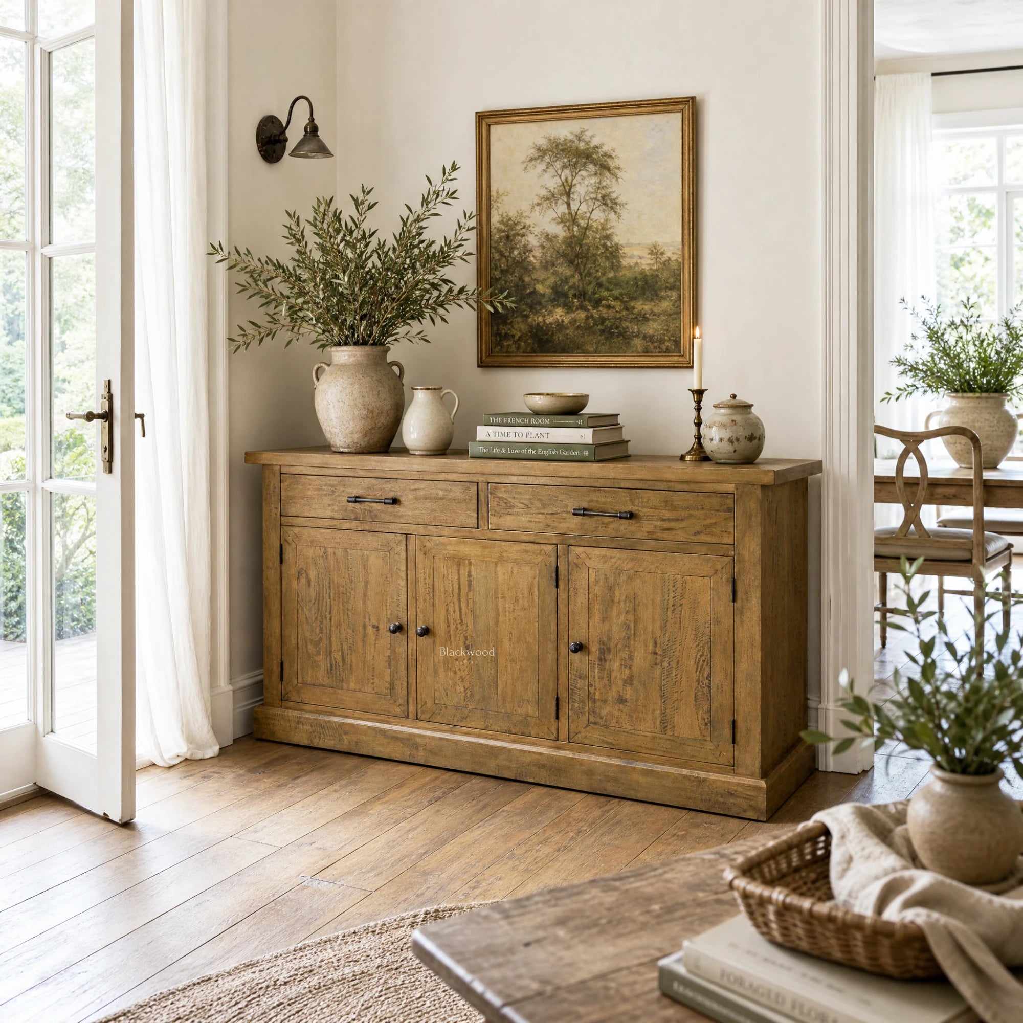 Marlborough Buffet in a sunlit dining room, solid mango wood with warm grain and a substantial, timeless profile.