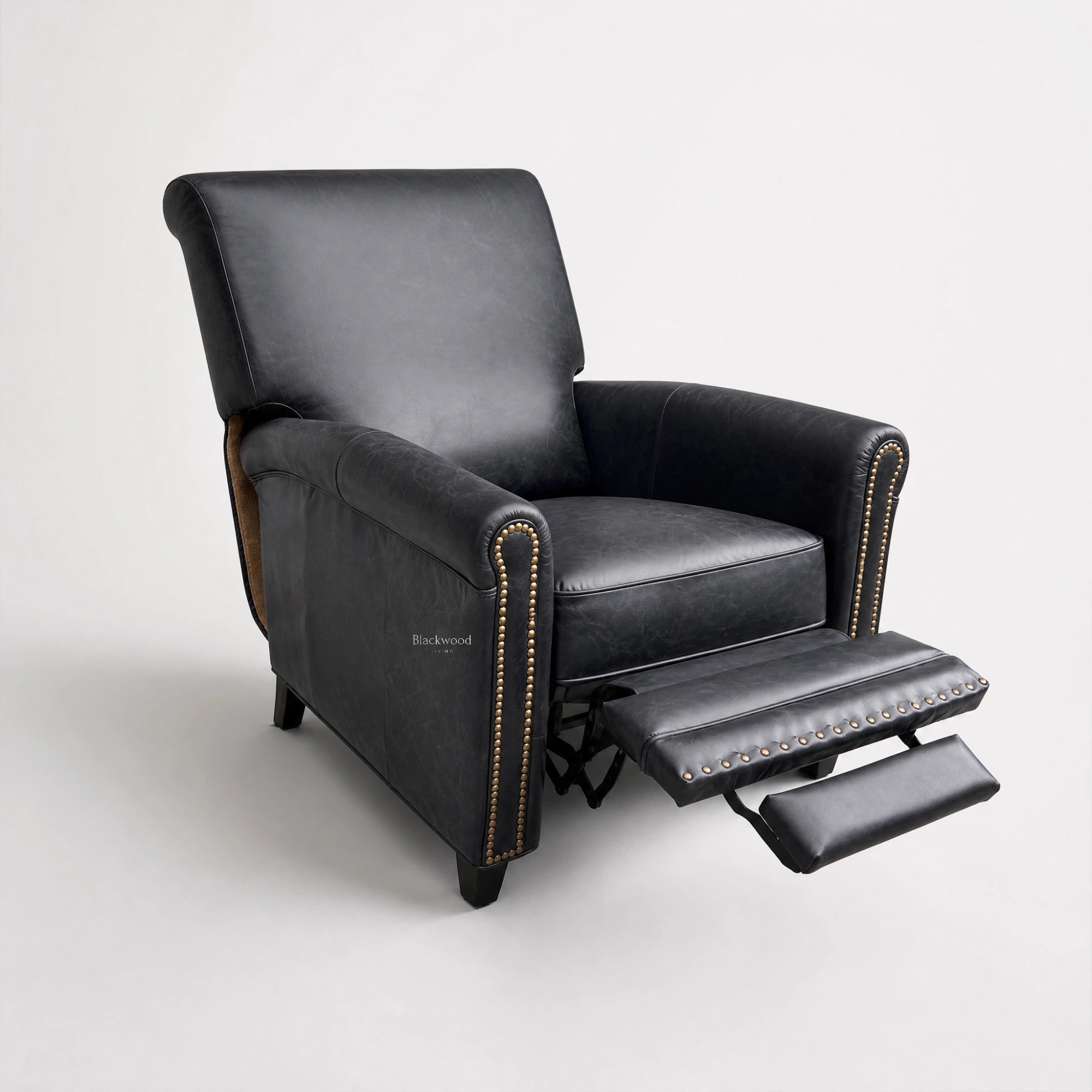 Chatsworth Leather Recliner Estate Black with nailhead trim and extended footrest.