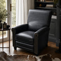 Chatsworth Leather Recliner - Estate Black in a cozy room with window, side table, and dark bookcase.