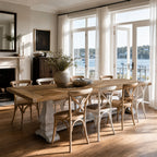 Eastport Dining Table crafted from reclaimed boat wood (teak and iron hardwoods) in a sunlit coastal dining room.
