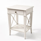 Harbour Bedside Table, white solid poplar, Hamptons-inspired, single drawer with brass knob, cross-legged base.