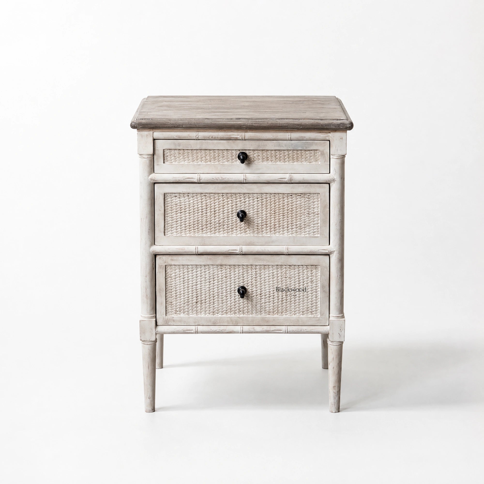 Laguna Bedside Table in distressed white with woven-panel drawers, coastal Hamptons-inspired styling.