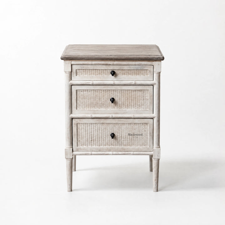 Laguna Bedside Table in distressed white with woven-panel drawers, coastal Hamptons-inspired styling.
