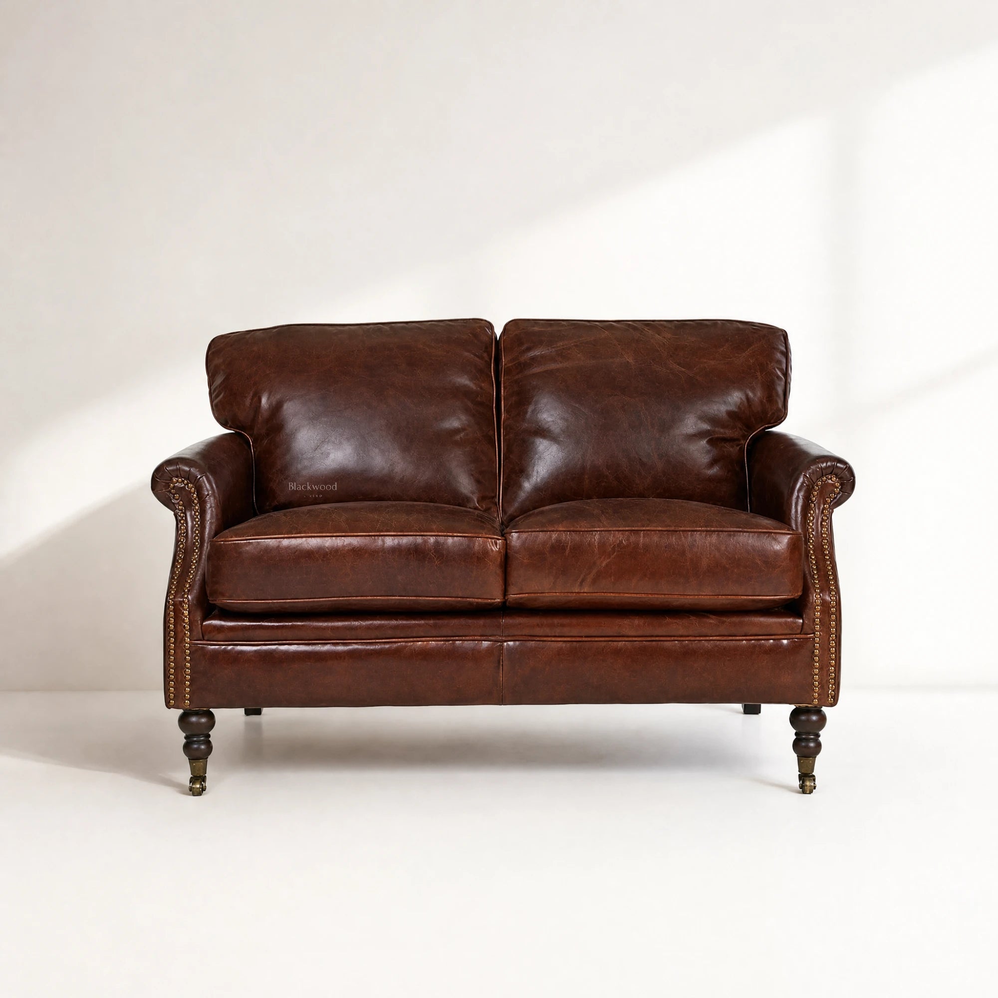 Kensington 2 Seat Sofa in South American top-grain cow leather; traditional, hand-finished, warm, timeless character.