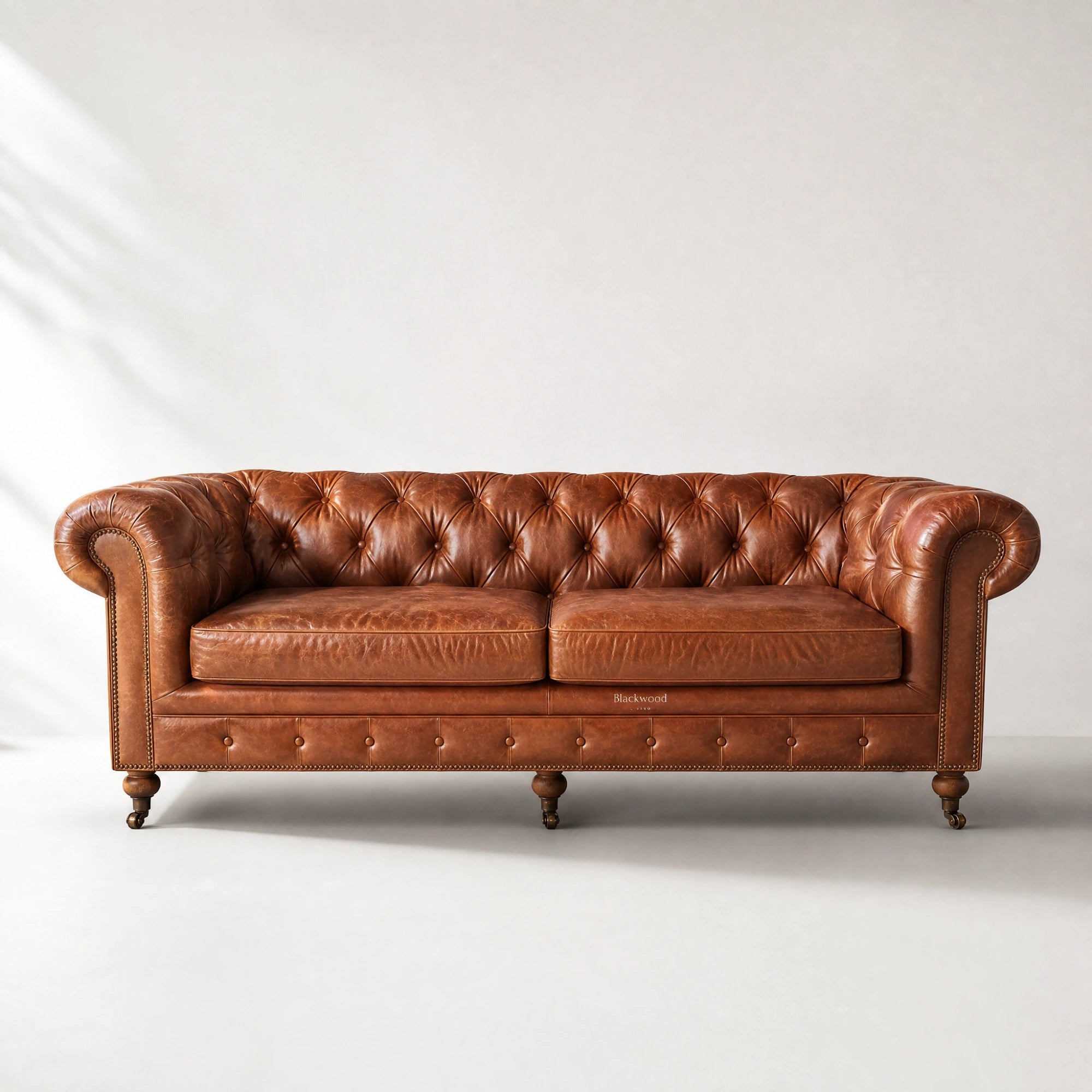 Ashcroft 3 Seat Sofa - Vintage Tan in top-grain cow leather with deep buttoned Chesterfield tufting, rolled arms, brass studs.