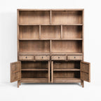 Fairhaven Wall Unit in weathered pine with a softly aged finish, featuring multiple open cubbies and bottom drawers.