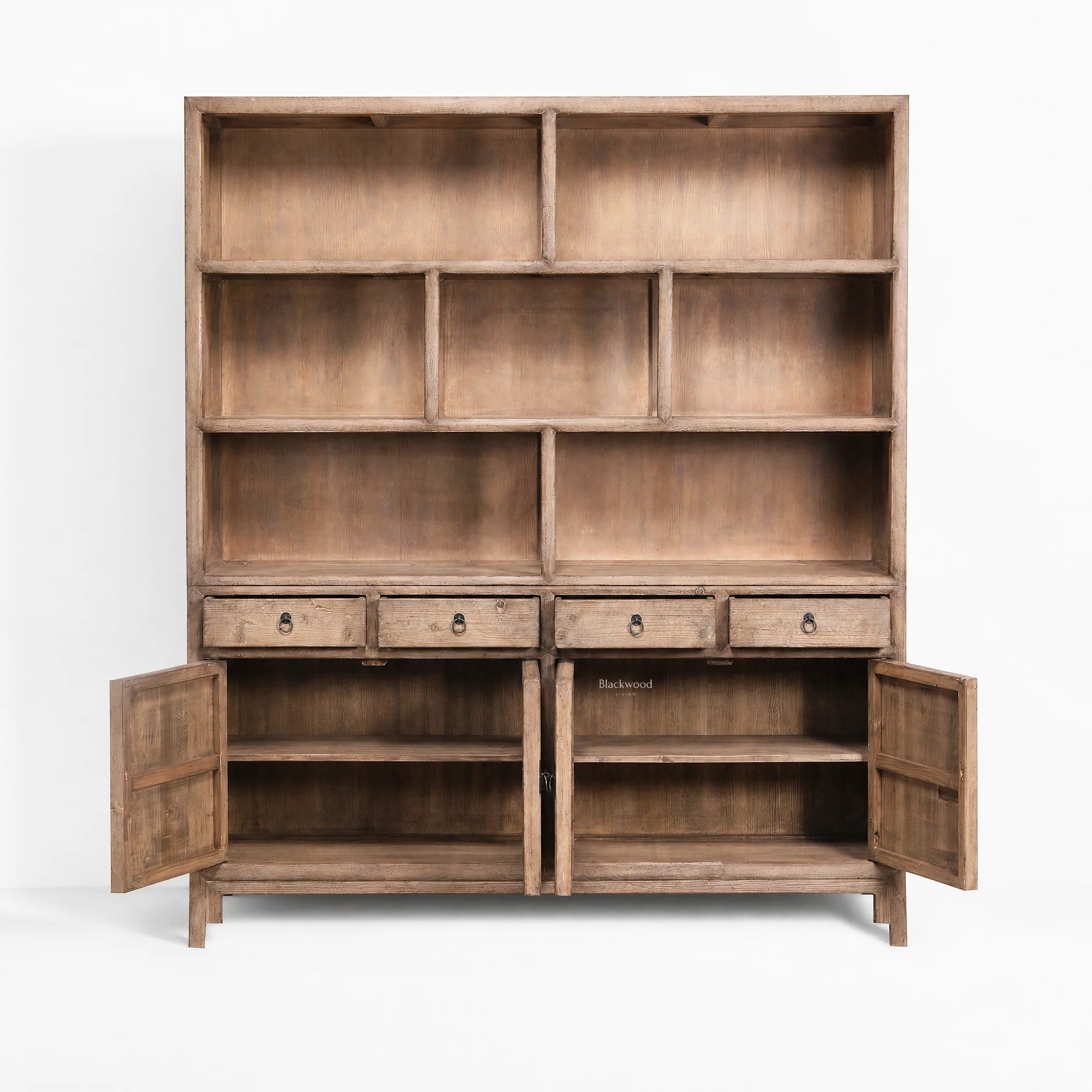 Fairhaven Wall Unit in weathered pine with a softly aged finish, featuring multiple open cubbies and bottom drawers.