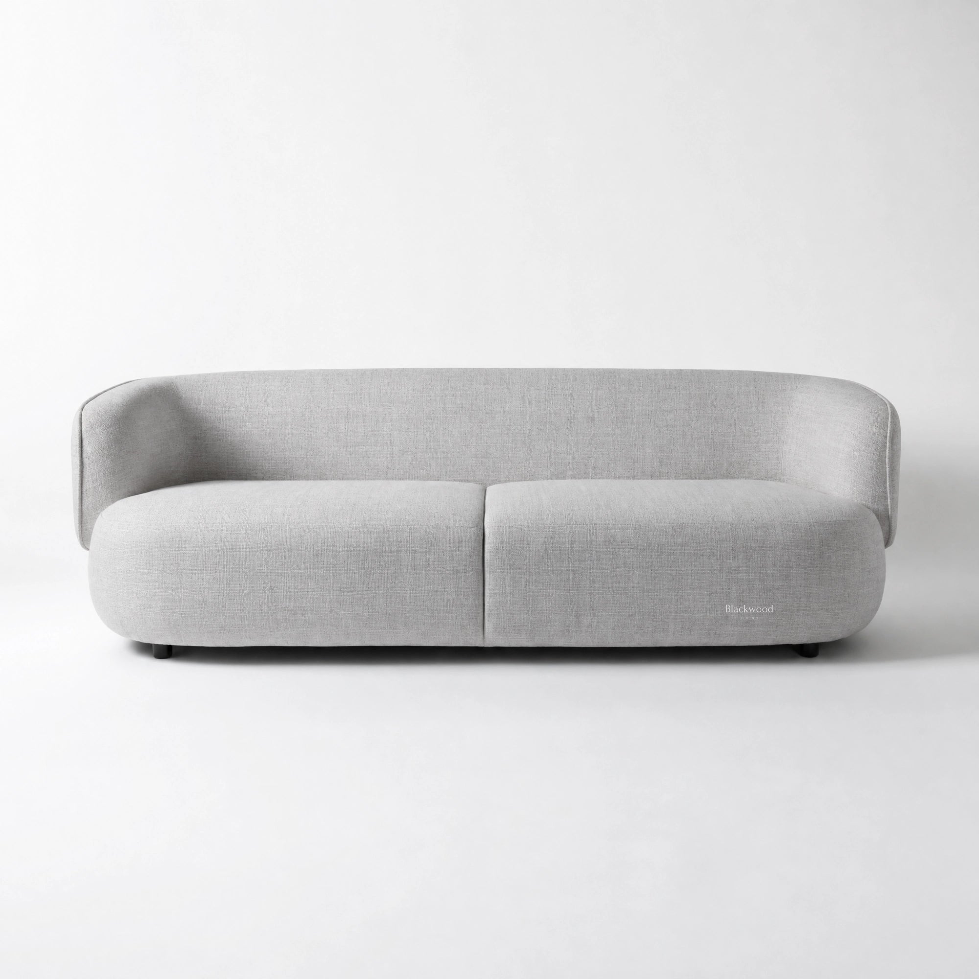 Amani Sofa in light grey textured fabric with softly curved arms and generous seating.
