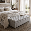Charlotte Linen Chest bedroom with a grey linen upholstered bed, white bedding, and a wooden dresser.