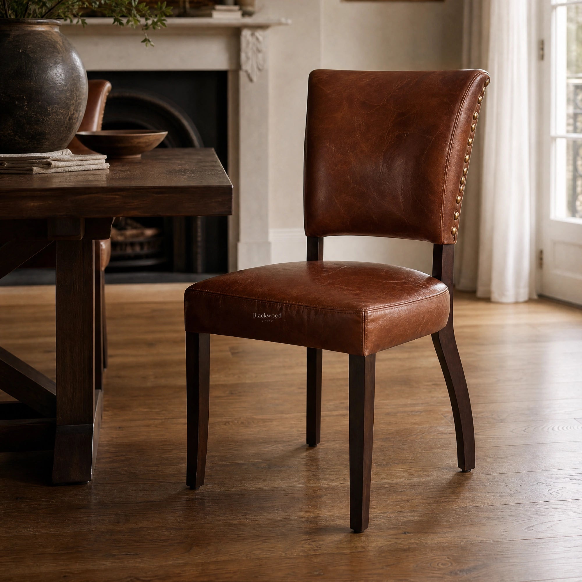 Beaumont Dining Chair - Vintage Tobacco in top-grain South American leather with nailhead trim.