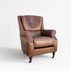 Beaumont Armchair in hand-finished top-grain leather, vintage tobacco color with rolled arms and nailhead trim.