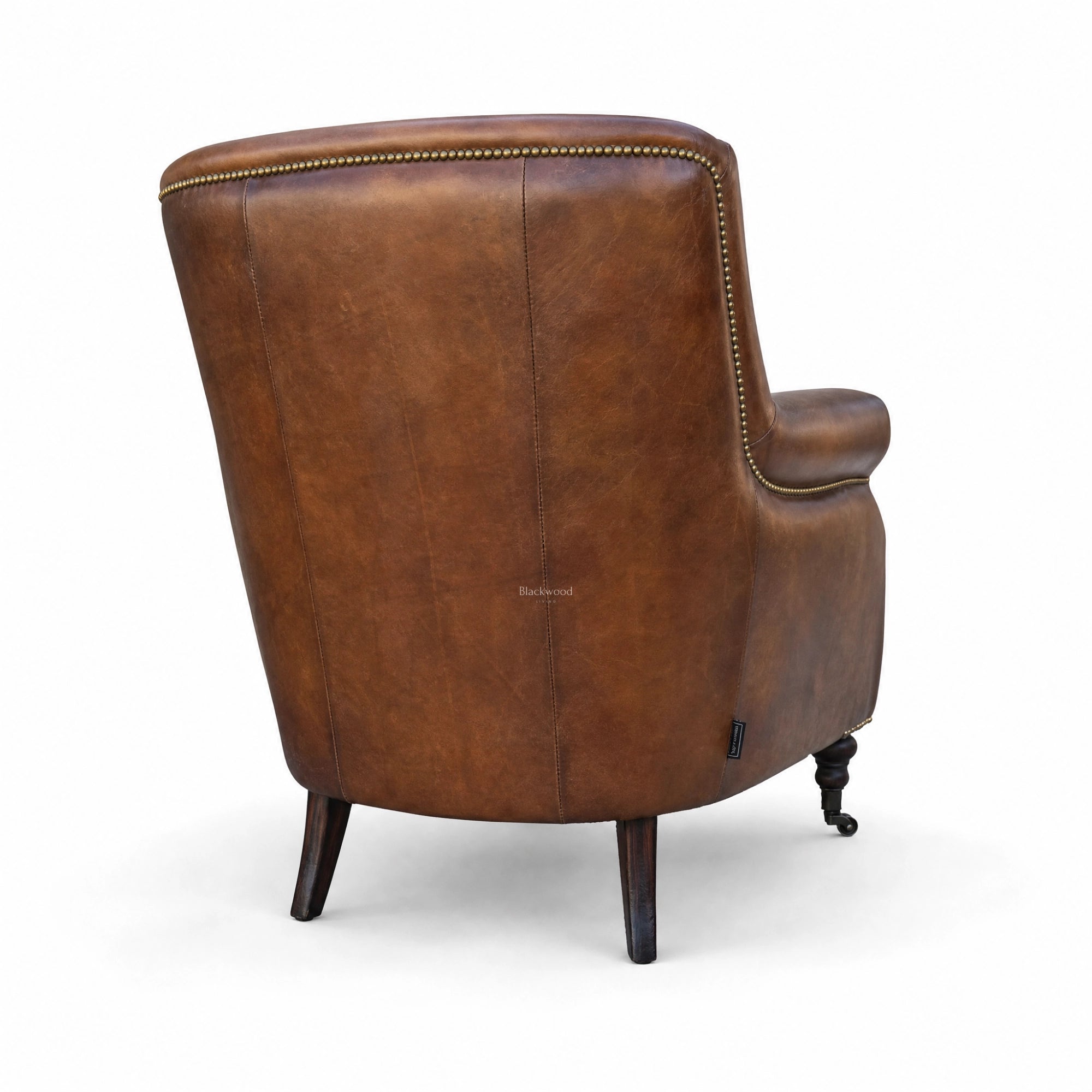 Beaumont Armchair in Vintage Tobacco hand-finished South American top-grain leather with brass nailhead trim.