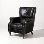 Beaumont Armchair Estate Black leather, hand-finished top grain, nailhead trim, wooden legs.