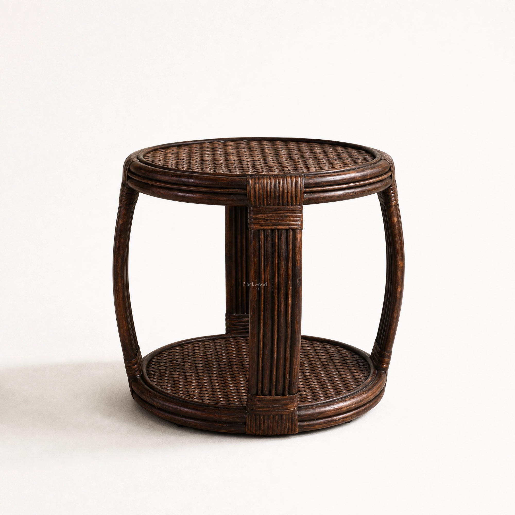 Havana Side Table with handwoven round rattan top, curved silhouette and warm dark finish.