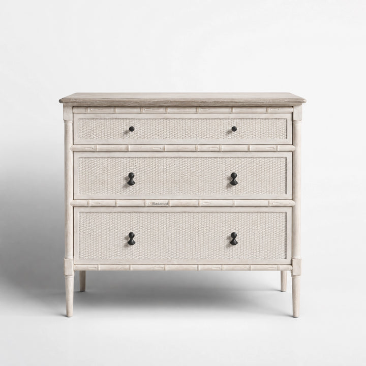 Laguna Dresser with soft antique finish, pale wood, handwoven rattan panels and bamboo-inspired framing.