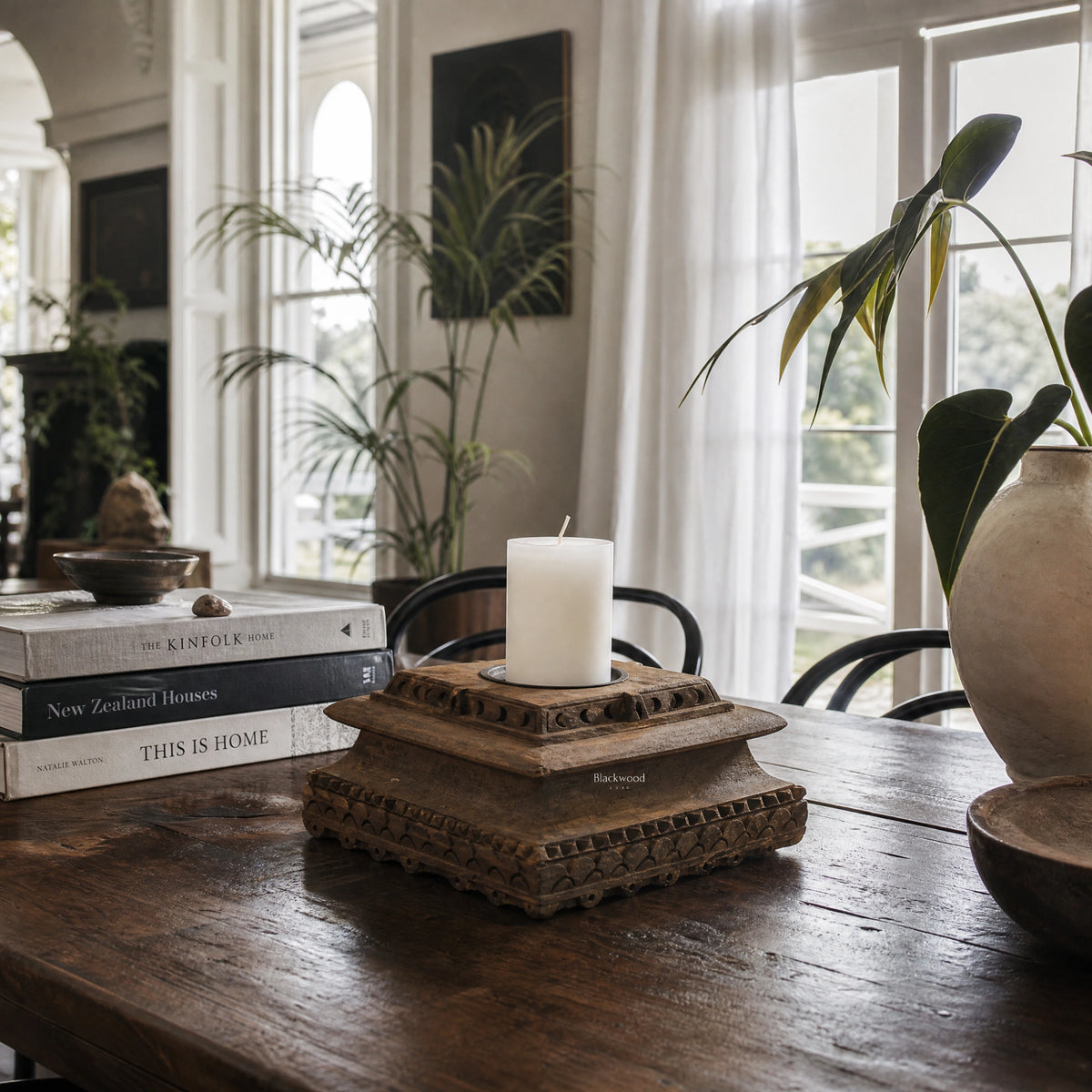 Jaipur Candle Holder in distressed wood reclaimed from Indian homes over 80 years old, atop a carved pedestal.