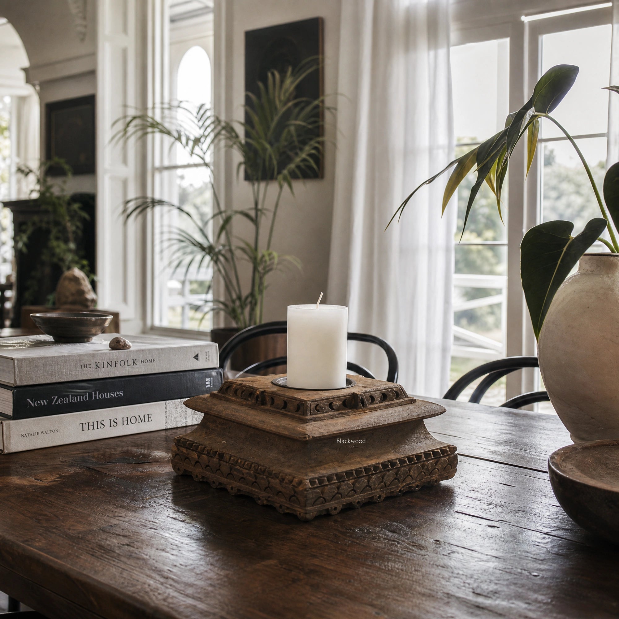 Jaipur Candle Holder in distressed wood reclaimed from Indian homes over 80 years old, atop a carved pedestal.