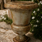 Provence Urn: antique marble-look magnesia garden urn with weathered finish for indoor and outdoor decor.
